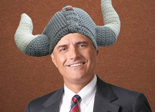 Business man wearing a funny hat