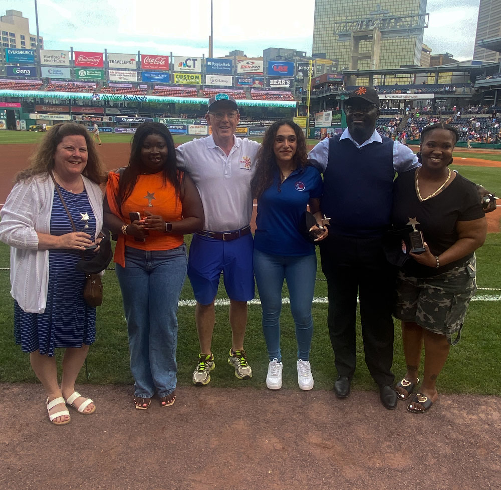 2026 TANGO Nonprofit Rising Star Scholarship winners on the ball field at Celebrate Nonprofits Night at the Hartford Yard Goats