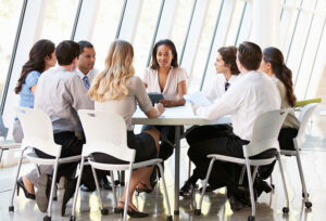 Diverse group of business people meeting around a table