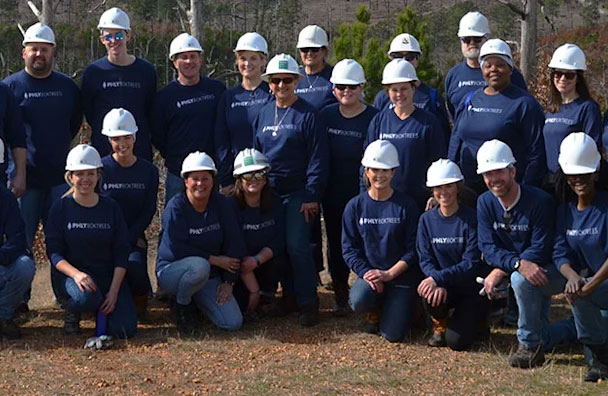 Philadelphia Insurance Companies team photo volunteering with hard hats on.