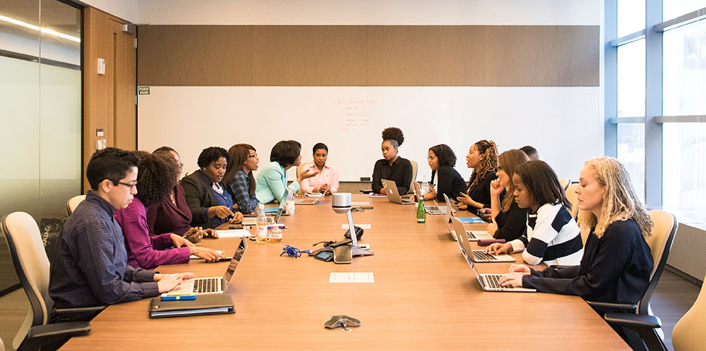 Women in meeting around conference table