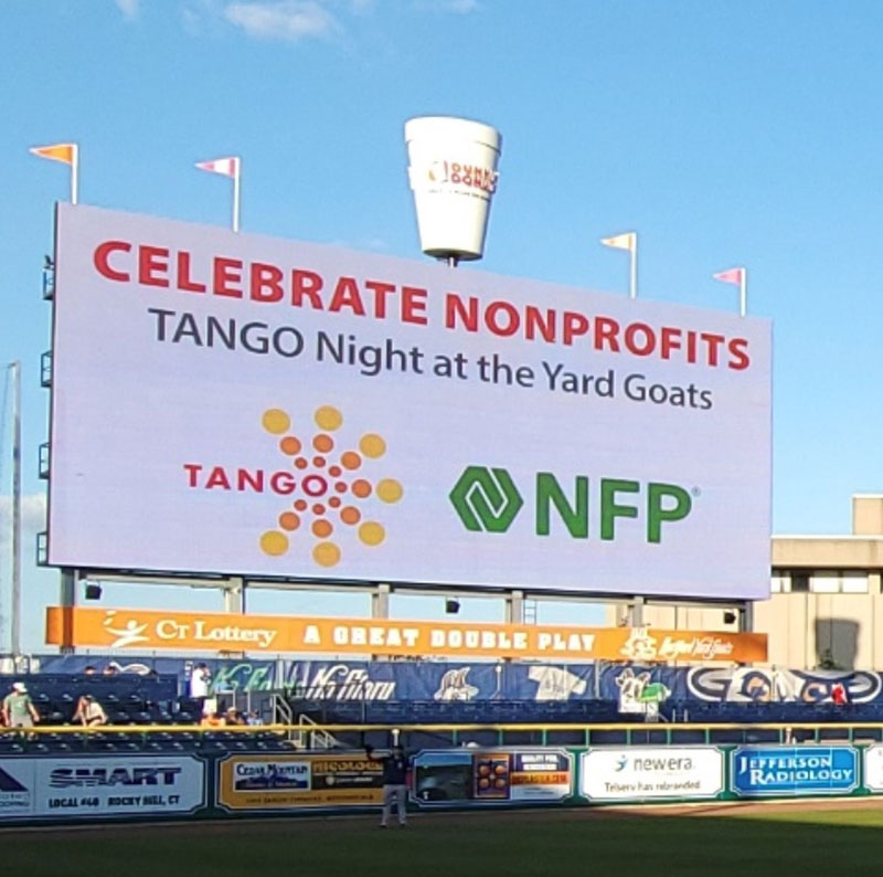 Yard Goats jumbotron with celebrate nonprofits and NFP and TANGO logos